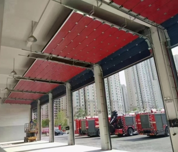 Industrial lifting doors are used in fire stations and can be opened manually when power is off